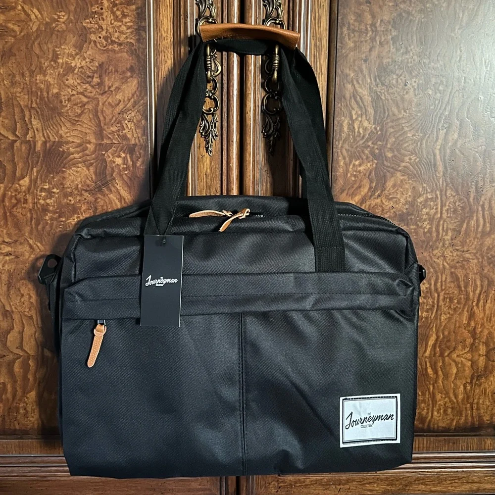 NWT The Journeyman Bag Co Duffle Bag in black with red mesh interior.